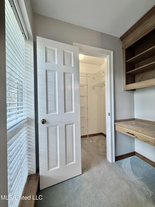 110 Frye Rd, Hattiesburg, MS 39401 - unfurnished bedroom with carpet flooring, a walk in closet, baseboards, and a closet