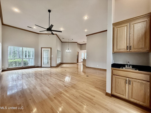 110 Frye Rd, Hattiesburg, MS 39401 - unfurnished living room with a sink, ceiling fan, healthy amount of natural light, ornamental molding, and baseboards