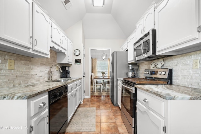 kitchen with a sink, stainless steel appliances, white cabinetry, decorative backsplash, and visible vents