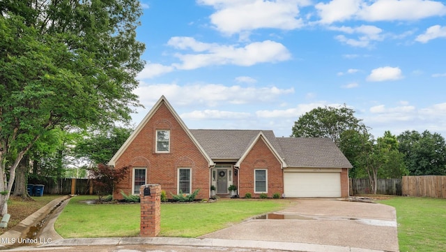 view of front of home with a garage, driveway, a front lawn, and brick siding