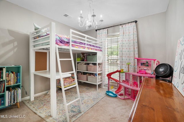 carpeted bedroom with an inviting chandelier and baseboards