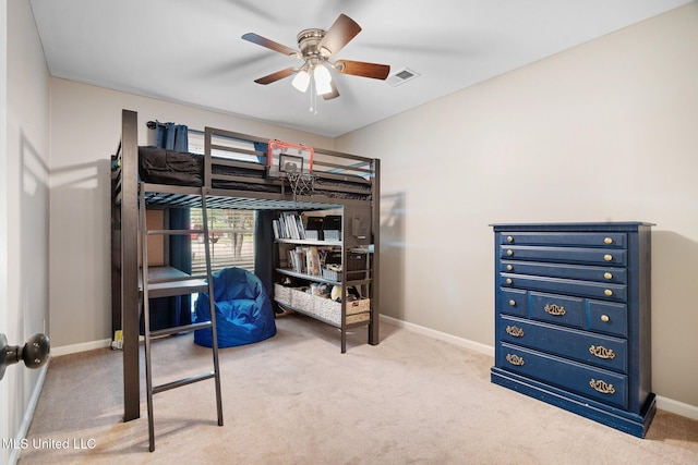 carpeted bedroom with baseboards, ceiling fan, and visible vents