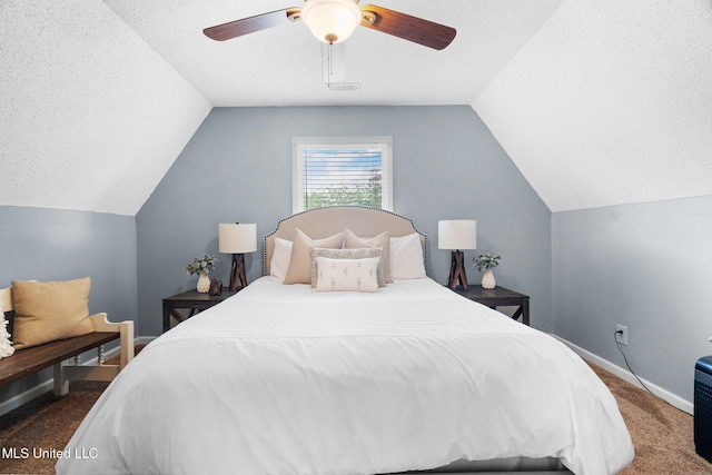 bedroom featuring carpet floors, a textured ceiling, a ceiling fan, baseboards, and vaulted ceiling