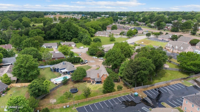 birds eye view of property with a residential view