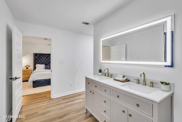 bathroom featuring vanity and hardwood / wood-style floors