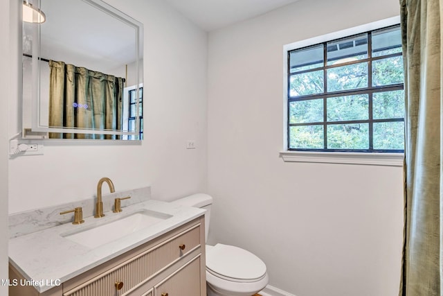 bathroom with vanity and toilet