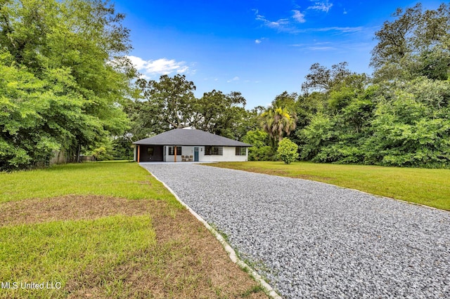 ranch-style house with a front lawn