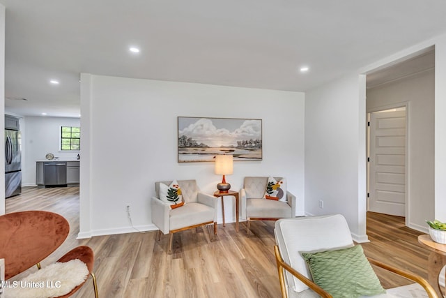 living area featuring light hardwood / wood-style floors