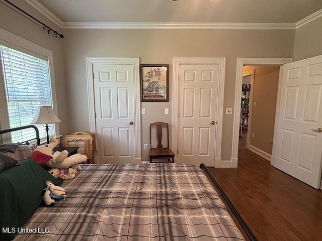 9053 Castalian Springs Rd, Durant, MS 39063 - bedroom with crown molding, baseboards, and wood finished floors