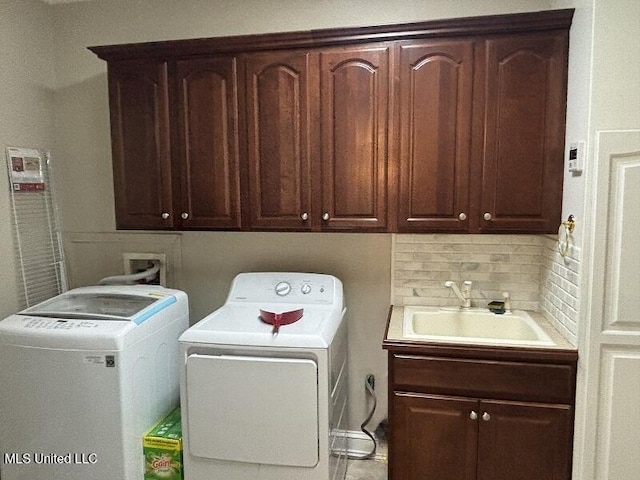 9053 Castalian Springs Rd, Durant, MS 39063 - washroom featuring a sink, cabinet space, and independent washer and dryer