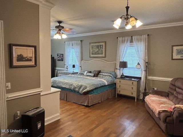 9053 Castalian Springs Rd, Durant, MS 39063 - bedroom featuring ornamental molding, ceiling fan with notable chandelier, and wood finished floors