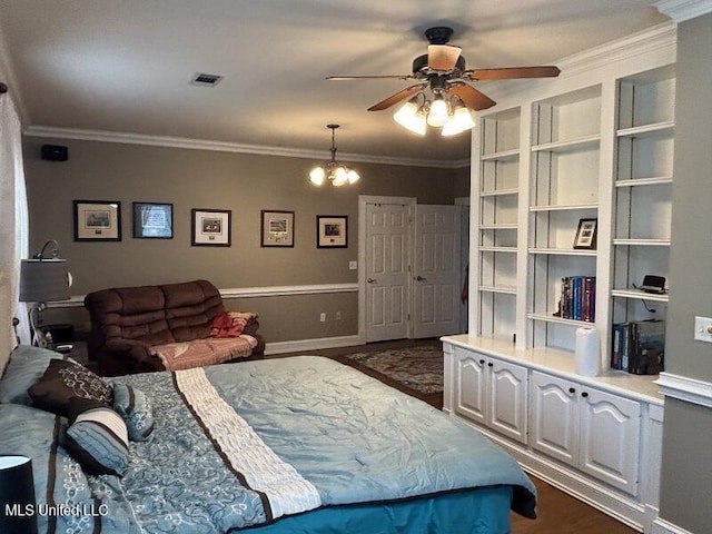 9053 Castalian Springs Rd, Durant, MS 39063 - bedroom with dark wood-type flooring, ornamental molding, ceiling fan with notable chandelier, and visible vents