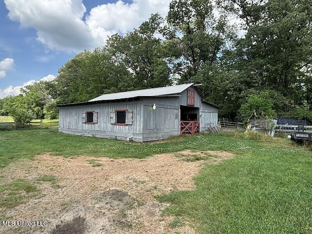 9053 Castalian Springs Rd, Durant, MS 39063 - view of barn with a lawn and fence