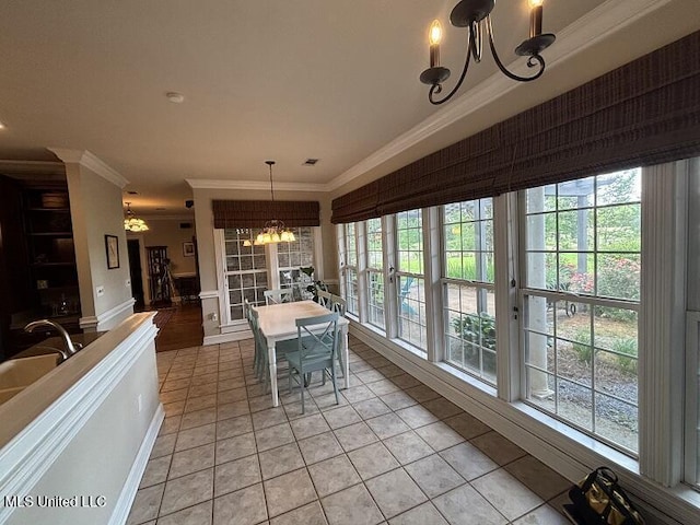 9053 Castalian Springs Rd, Durant, MS 39063 - dining space featuring crown molding, a healthy amount of sunlight, and a notable chandelier