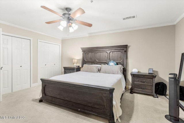 78 Bayou Cir, Gulfport, MS 39507 - bedroom featuring light carpet, two closets, crown molding, ceiling fan, and baseboards