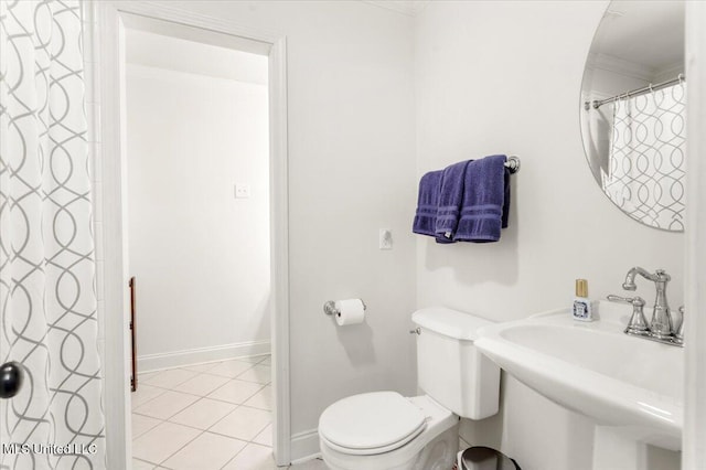 78 Bayou Cir, Gulfport, MS 39507 - bathroom with ornamental molding, tile patterned flooring, a sink, baseboards, and toilet