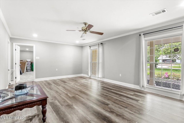 78 Bayou Cir, Gulfport, MS 39507 - unfurnished living room with healthy amount of natural light, ceiling fan, wood finished floors, ornamental molding, and recessed lighting