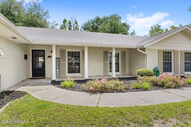 78 Bayou Cir, Gulfport, MS 39507 - doorway to property with a porch and brick siding