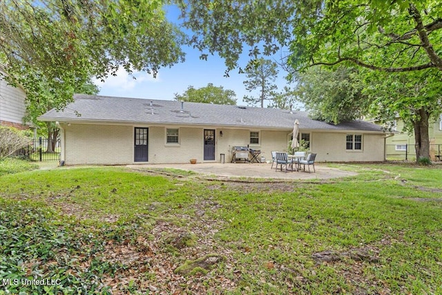 78 Bayou Cir, Gulfport, MS 39507 - back of property with a patio area and brick siding