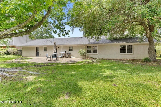 78 Bayou Cir, Gulfport, MS 39507 - back of house with a patio, a yard, and brick siding