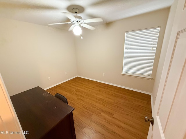 999 Hamakua St, Diamondhead, MS 39525 - unfurnished bedroom featuring wood finished floors and ceiling fan