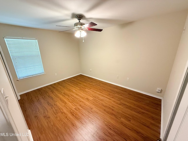 999 Hamakua St, Diamondhead, MS 39525 - unfurnished room with wood finished floors and ceiling fan