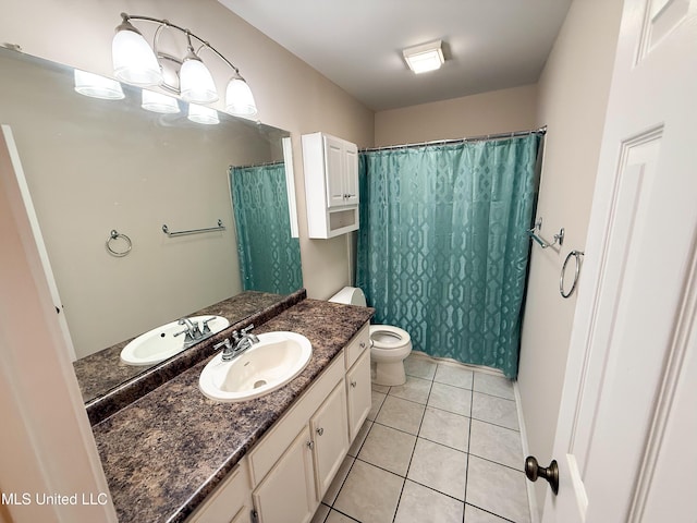 999 Hamakua St, Diamondhead, MS 39525 - bathroom featuring vanity, tile patterned flooring, and curtained shower