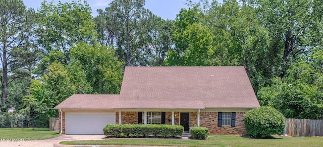 828 Briarwood Dr, Jackson, MS 39211 - view of front of house featuring an attached garage, driveway, and brick siding
