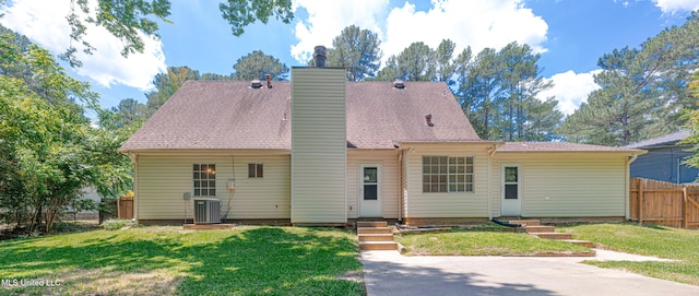 828 Briarwood Dr, Jackson, MS 39211 - back of property with entry steps, cooling unit, and a chimney