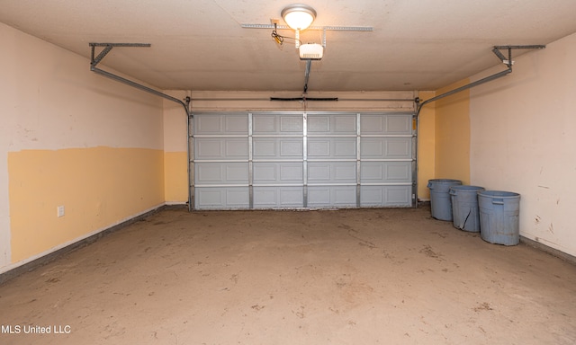 828 Briarwood Dr, Jackson, MS 39211 - garage featuring a garage door opener and baseboards