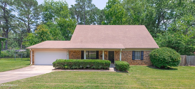 828 Briarwood Dr, Jackson, MS 39211 - view of front of house featuring an attached garage, concrete driveway, brick siding, and covered porch
