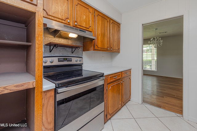 828 Briarwood Dr, Jackson, MS 39211 - kitchen featuring stainless steel electric range oven, under cabinet range hood, open shelves, and brown cabinets