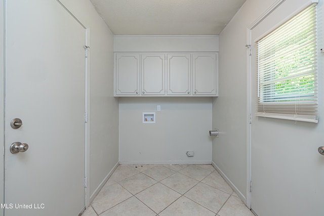 828 Briarwood Dr, Jackson, MS 39211 - washroom featuring hookup for a washing machine, cabinet space, light tile patterned floors, and baseboards