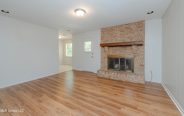 828 Briarwood Dr, Jackson, MS 39211 - unfurnished living room featuring wood finished floors and a fireplace