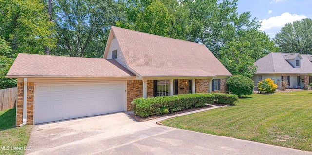 828 Briarwood Dr, Jackson, MS 39211 - view of front of house with driveway, an attached garage, and brick siding