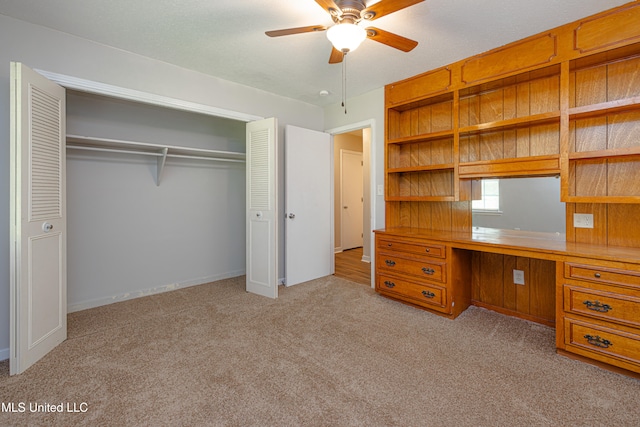 828 Briarwood Dr, Jackson, MS 39211 - unfurnished office featuring ceiling fan, built in desk, carpet floors, and baseboards
