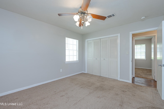 828 Briarwood Dr, Jackson, MS 39211 - unfurnished bedroom with carpet, a closet, baseboards, and a ceiling fan