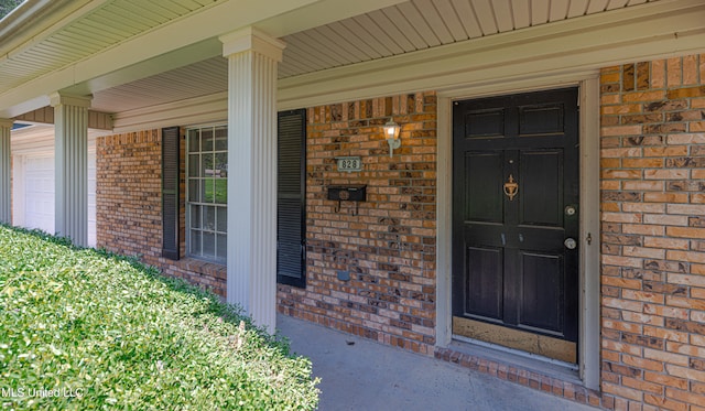 828 Briarwood Dr, Jackson, MS 39211 - entrance to property featuring brick siding and covered porch