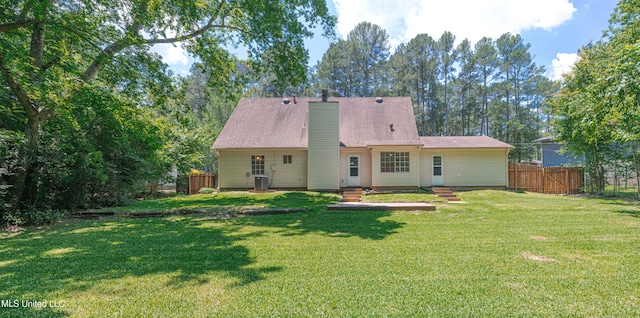 828 Briarwood Dr, Jackson, MS 39211 - rear view of house featuring a chimney and central AC