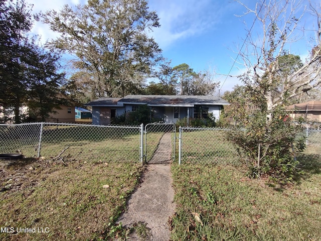 back of property with a lawn