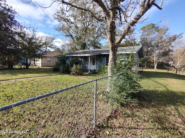 back of property featuring a yard