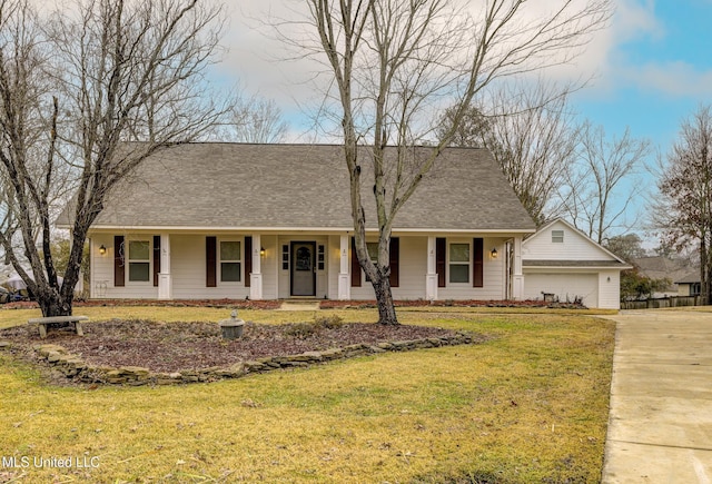 ranch-style home with a garage and a front yard