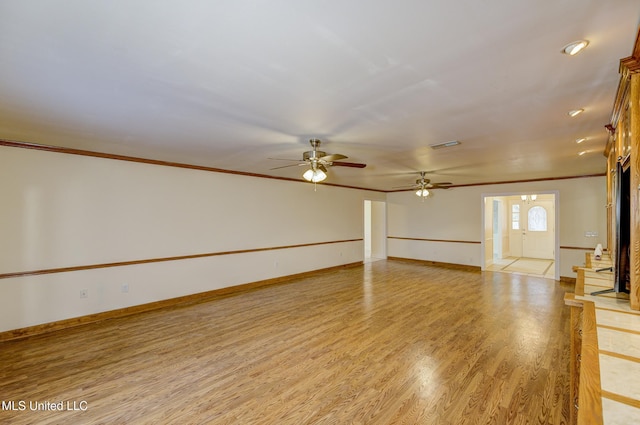 unfurnished living room with ornamental molding, ceiling fan, and light hardwood / wood-style floors