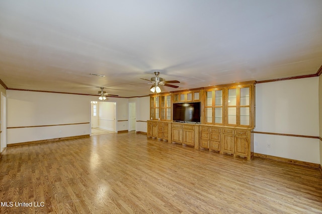 unfurnished living room with crown molding, ceiling fan, and light wood-type flooring