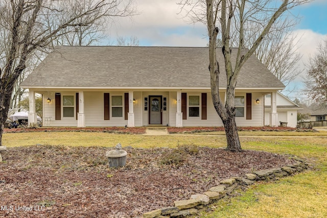 view of front of house with a front yard and covered porch