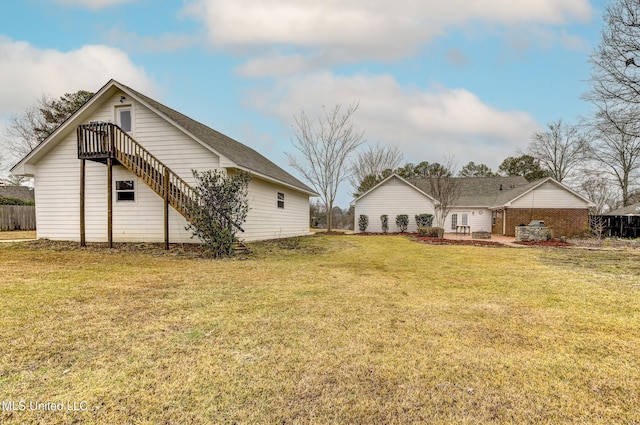 back of property with a lawn