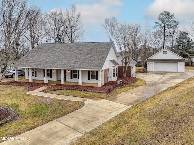 view of front facade with a garage, covered porch, and a front lawn