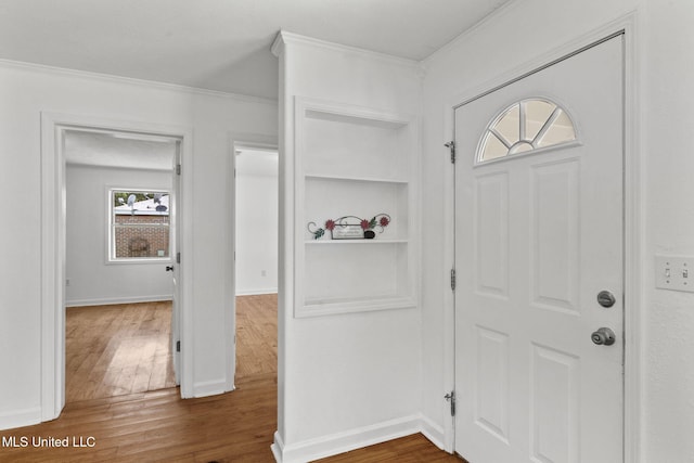 1914 Twin Pine Dr, Pearl, MS 39208 - foyer with dark wood finished floors, crown molding, and baseboards