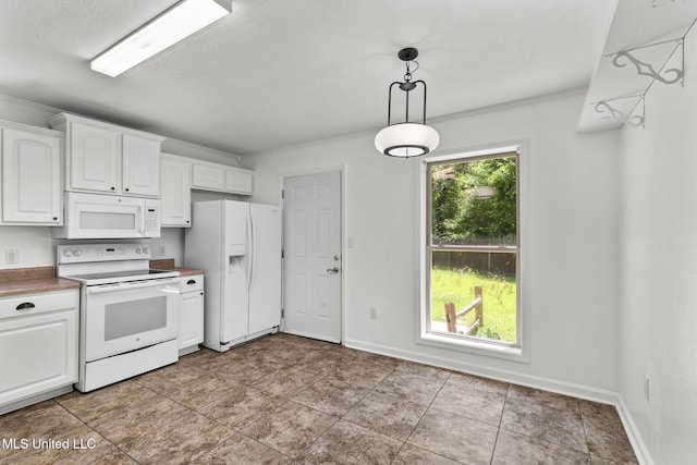 1914 Twin Pine Dr, Pearl, MS 39208 - kitchen featuring white appliances, white cabinetry, pendant lighting, and baseboards