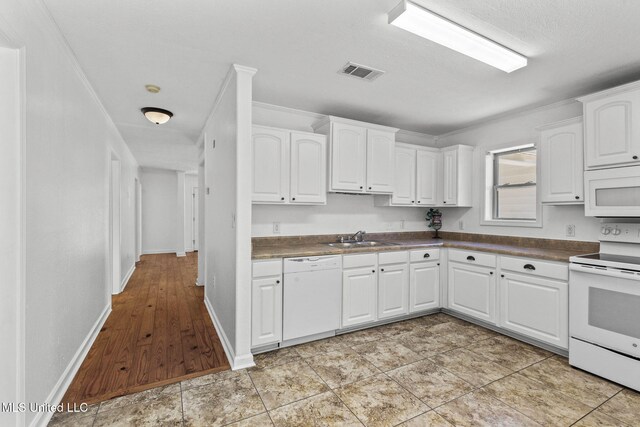 1914 Twin Pine Dr, Pearl, MS 39208 - kitchen with white appliances, a sink, dark countertops, white cabinetry, and crown molding